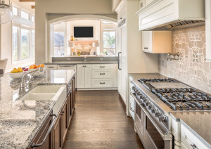 45169096 - kitchen with range, sink, and hardwood floors in new luxury home